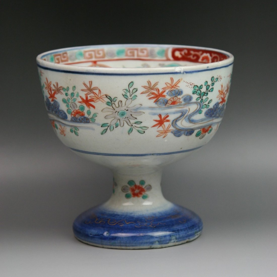Antique Japanese Imari Gilt Porcelain Stem Bowl: Antique Japanese Imari Gilt Porcelain Stem Bowl: exterior with the continuous design of scattering flower sprays and foliage: interior with one large peach branch at the center in double blue circles: