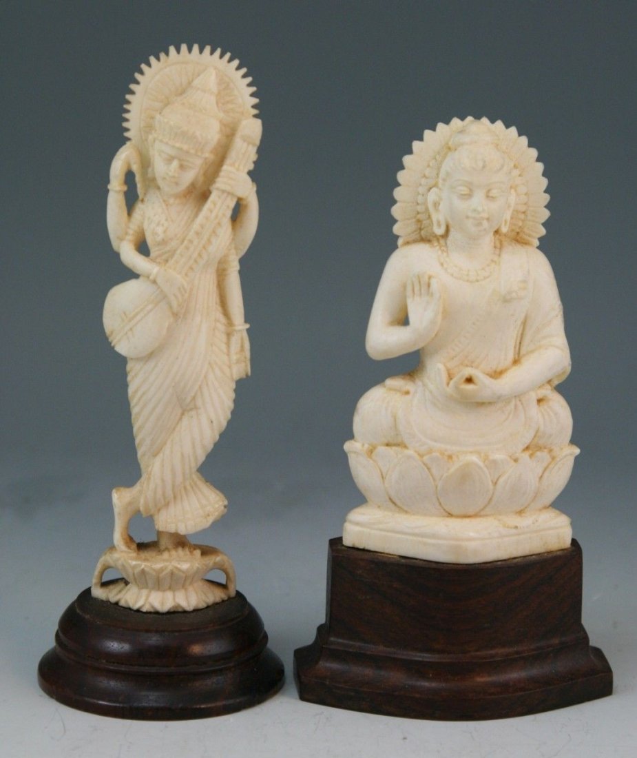 Two Indian Antique Ivory Carvings: Two Indian carved ivory items: finely carved and fully reticulated throughout, one Hindu Buddha with typical seated position on lotus base, together with the four-armed goddess Lakshmi standing on a l