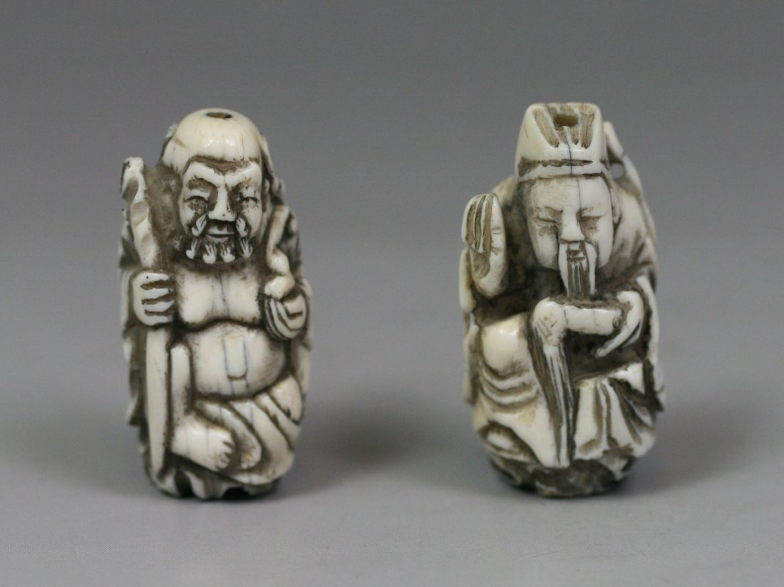 Pair Of Antique Ivory Netsukes: Pair of Antique Ivory Netsukes: two men standing while holding tools in their hands.; Size: H: 1-1/2"