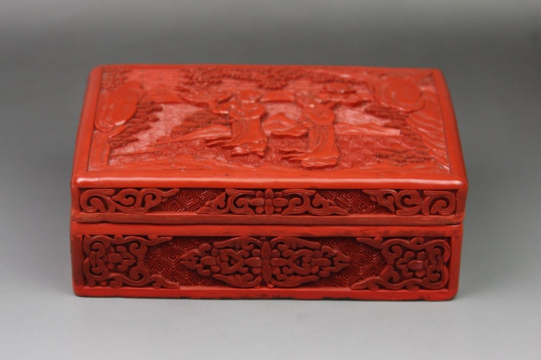 A Well Carved Cinnabar Lacquer Box And Cover: A Well Carved Cinnabar Lacquer Box And Cover: both parts of rectangular shape, exterior of the box and cover carved overall with the design of two beauties standing in flowed robes carrying a large lo