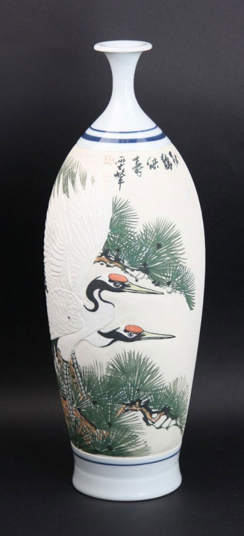 Japanese Antique Ikebana Porcelain Vase: Japanese Antique Ikebana Porcelain Vase: painted around the ovoid body with cranes among pine trees, tapering to a very slender neck with flared rim, inscribed horizontally in a line and with three ma