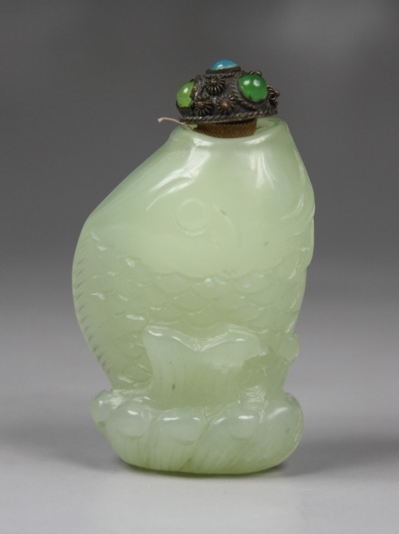 A Chinese Celadon Jade Snuff Bottle: A Chinese Celadon Jade Snuff Bottle: carved as fish shape, with jeweled stopper; Size: H: 2-7/8"