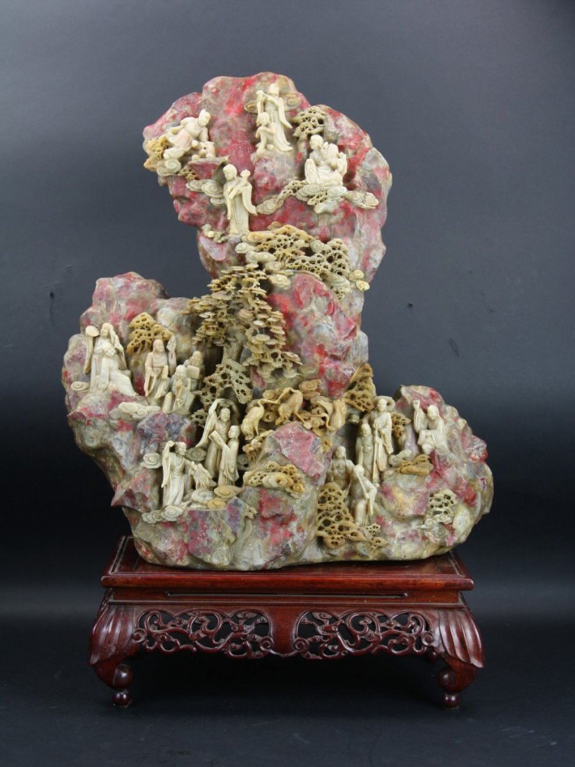 A Rare And Massive 'Chicken's-Blood' Soapstone Mou: A Rare And Massive Carved 'Chicken's-Blood' Soapstone Mountain: massive and very elaborately carved, Chinese 'Chicken's-Blood' soapstone mountain weighing approximately 108lbs, of variously stepped ro
