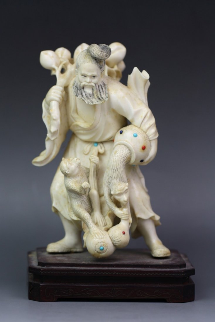 Chinese Carved Jeweled Ivory Group: Chinese Carved Jeweled Ivory Group: carved as a male figure carrying a huge peach branch on his shoulder, while a monkey coming out of a basket and hold the spout of a gourd, with another monkey holdi
