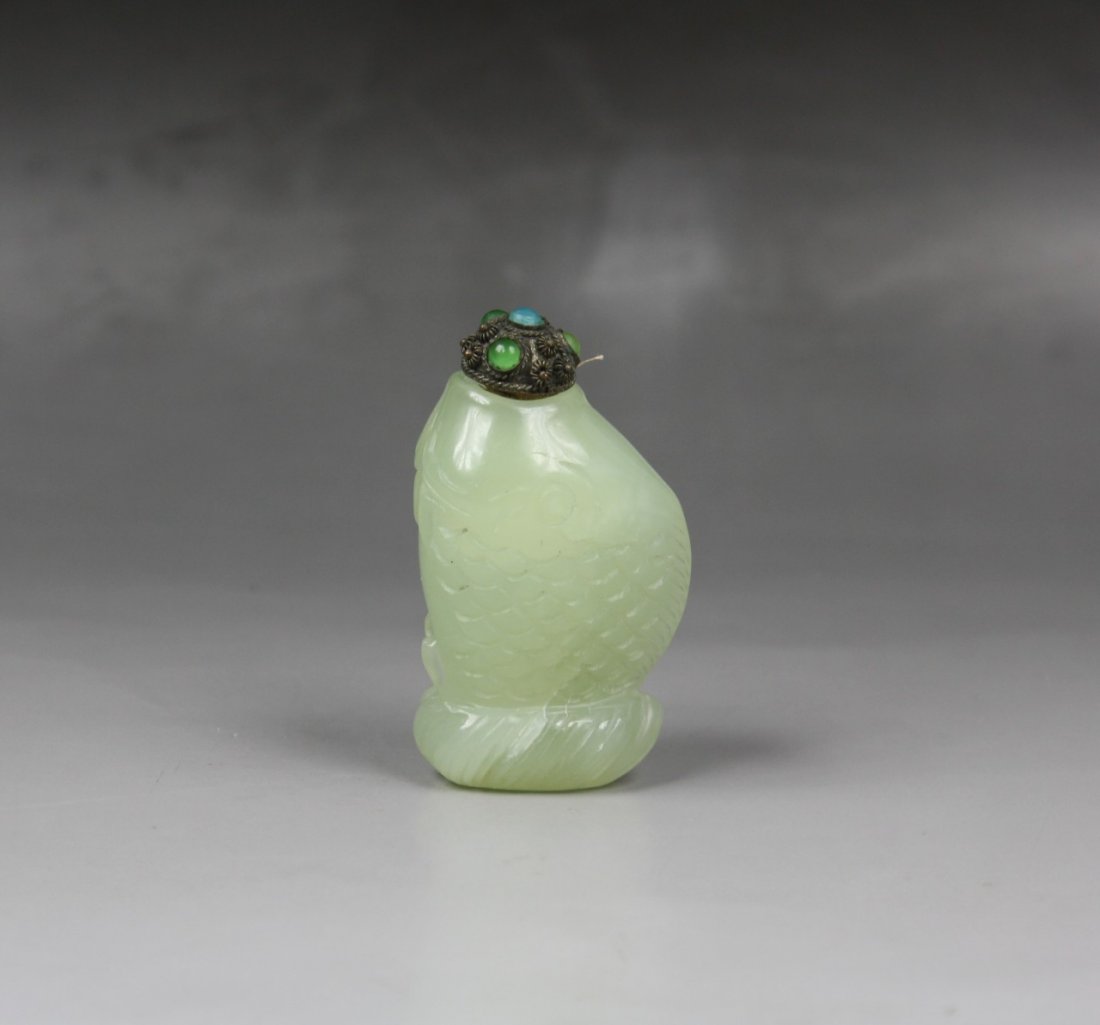 A Chinese Celadon Jade Snuff Bottle: A Chinese Celadon Jade Snuff Bottle: carved as fish shape, with jeweled stopper; Size: H: 2-7/8"