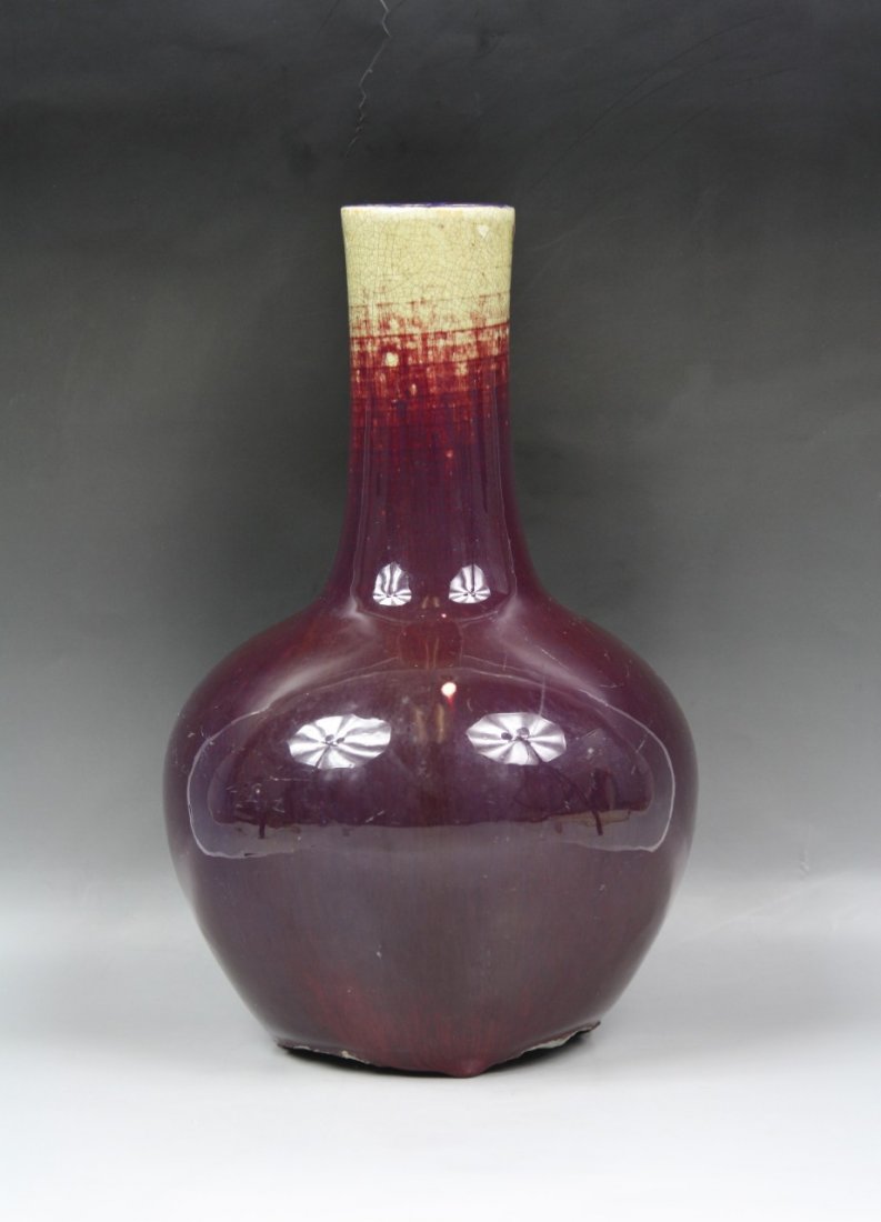 A Chinese Antique Ox Blood Porcelain Vase: A Chinese Antique Ox Blood Porcelain Vase: of globular body with long cylindrical neck, of late Qing Dynasty; Size: H: 12"