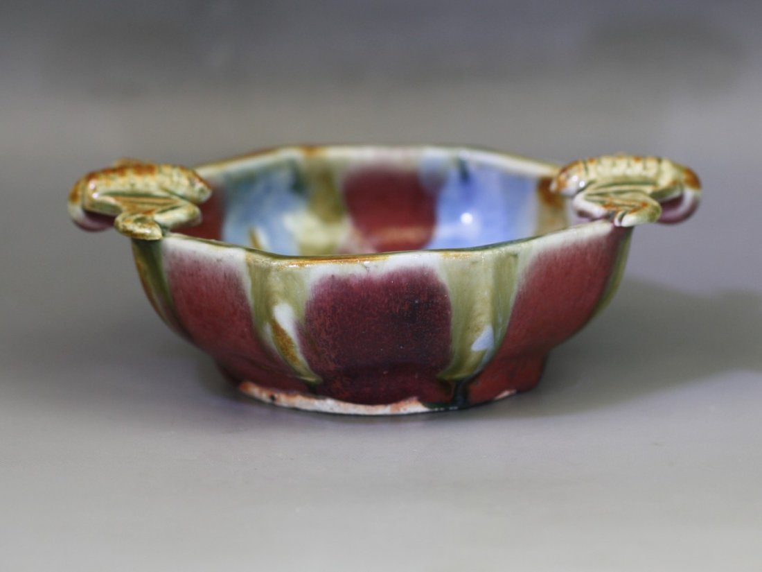 A Rare Octagonal Bowl: A Rare Octagonal Bowl: of octagonal form, applied with a thick glaze mutating from bright crimson to vivid violet and sky-blue tones, two bats molded in high relief perched on the rim under a bluish b