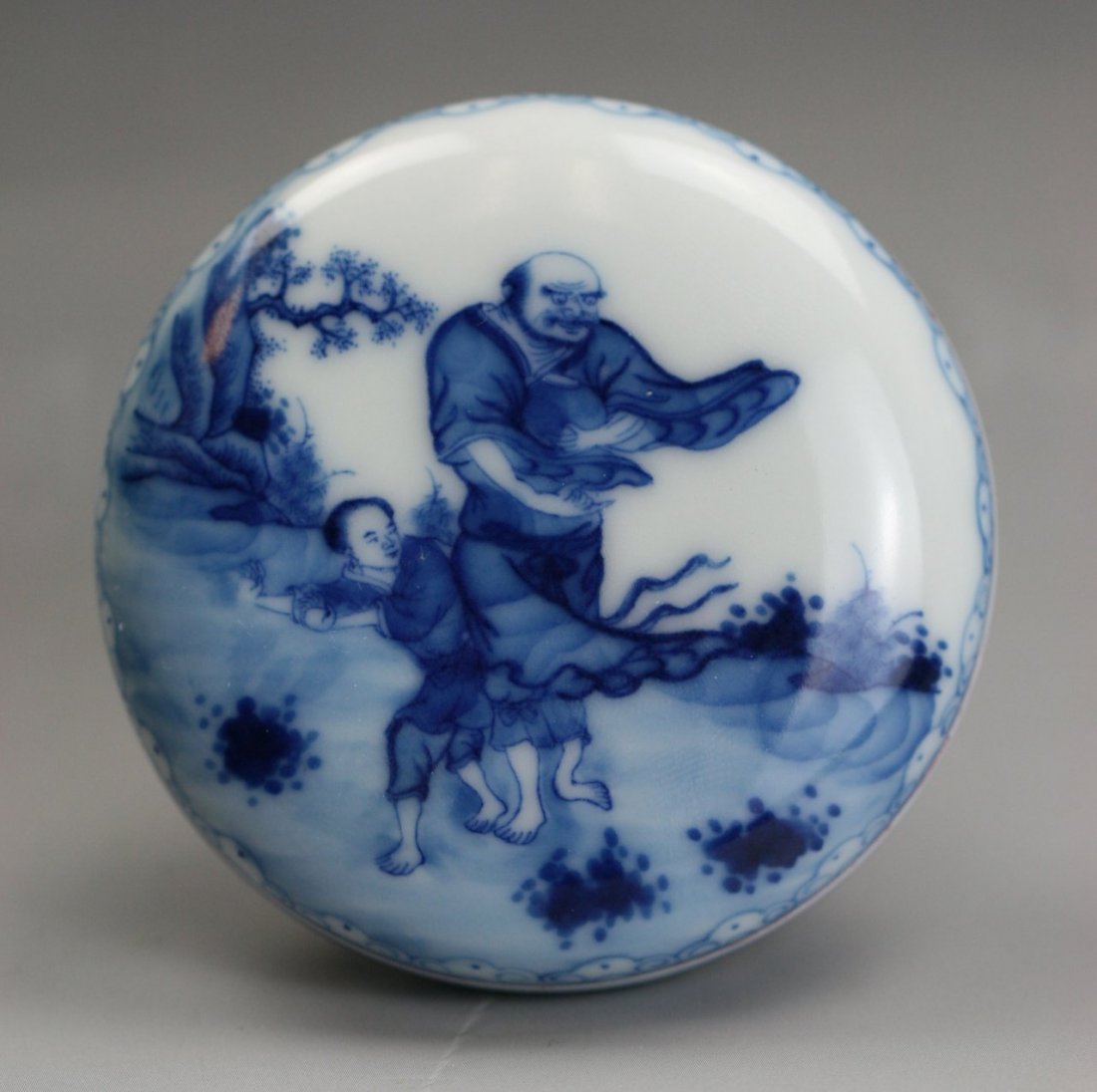Chinese Blue & White Porcelain Ink Case W Cover: Chinese Blue & White Porcelain Ink Case W Cover: of rounded shape, painted on the cover in cobalt blue with figures in courtyard, with 'Qianlong' Mark on the base but probably of Minguo Period; Size: 