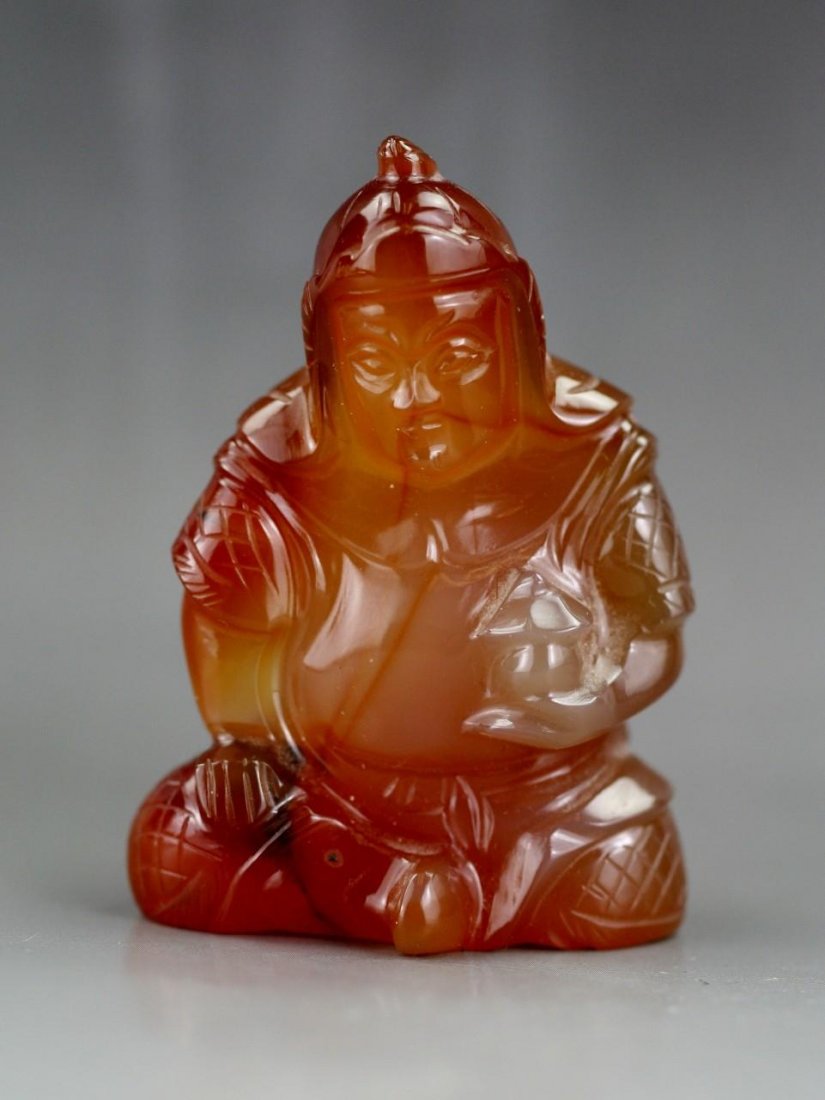 A Chinese Carnelian Agate Carving Of Figure: A Chinese Carnelian Agate Carving Of Figure: well carved and polished from the agate with semi-translucent warm red tone, circa 1900; Size: H: 2-1/4"