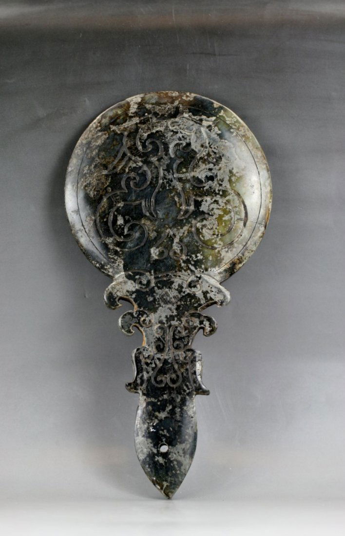 Chinese Archaic Jade Hand Held Mirror: Chinese Archaic Jade Hand Held Mirror: carved from the jade with dark green tone, probably of Shang or Zhou Dynasty; Size: H: 9"