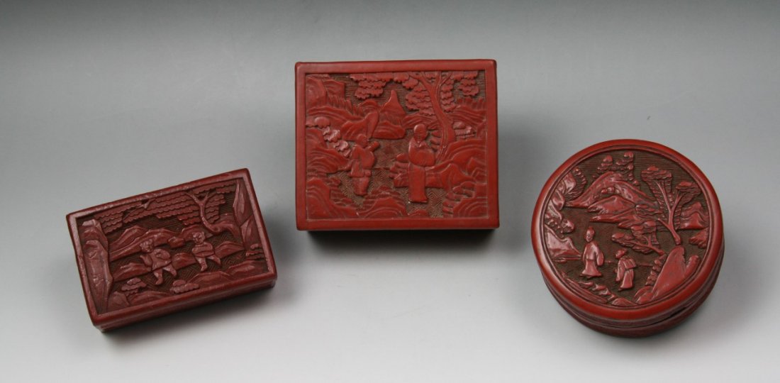 Three (3) Chinese Cinnabar Red Lacquer Boxes: Three (3) Chinese Antique Cinnabar Red Lacquer Boxes: two of rectangular forms and one of circular form, finely carved with the different scenes of figures within landscapes, all of late Qing Dynasty;