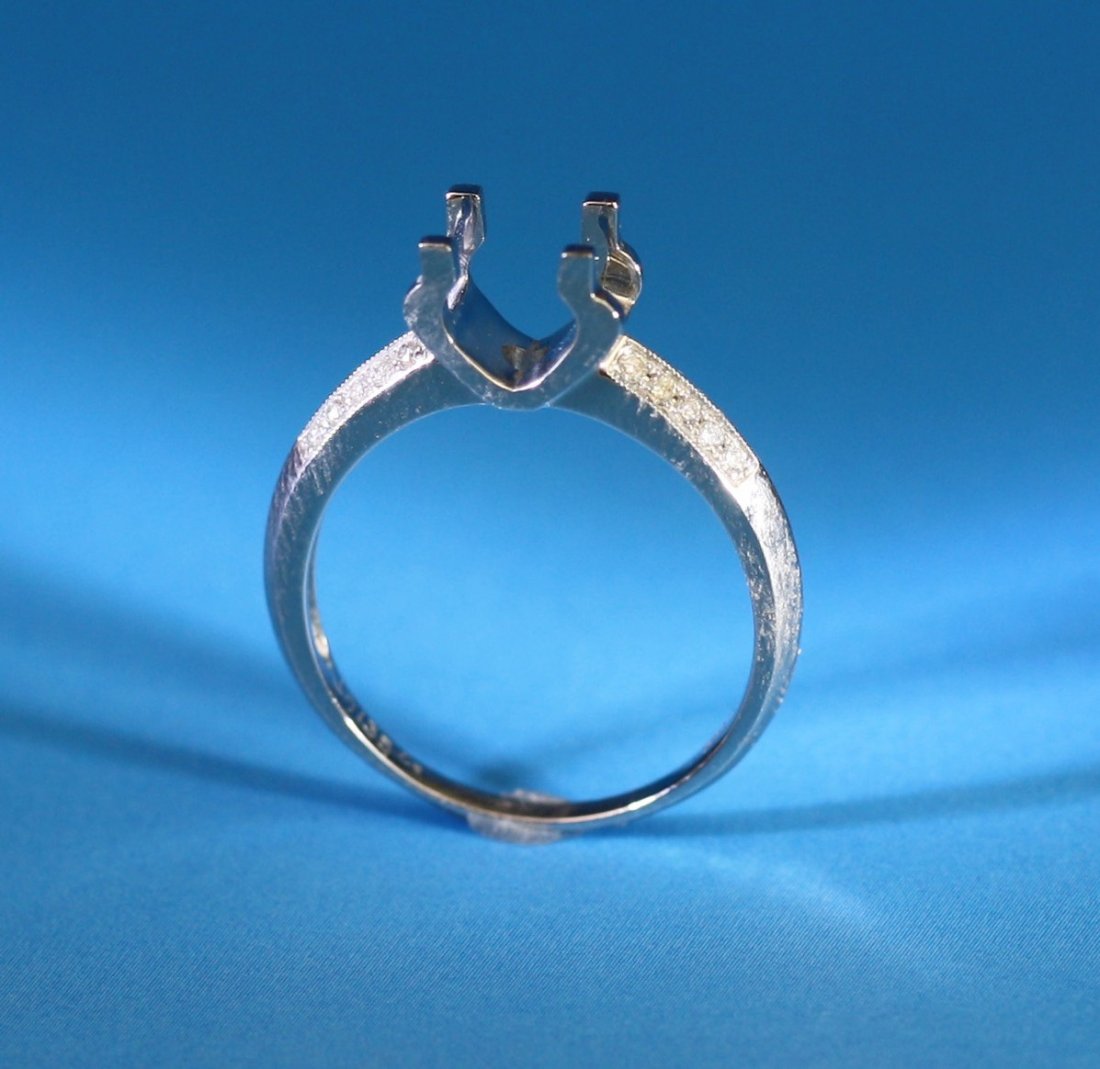 New Engagement Diamond Ring Setting 18K W Gold: New Engagement Diamond Ring Setting 18K W Gold: after a Cartier design, solitaire ox-head shaped, with 20 round-cut natural diamonds weighing approximately 0. 3cts channel-set in 4. 0g finely polished