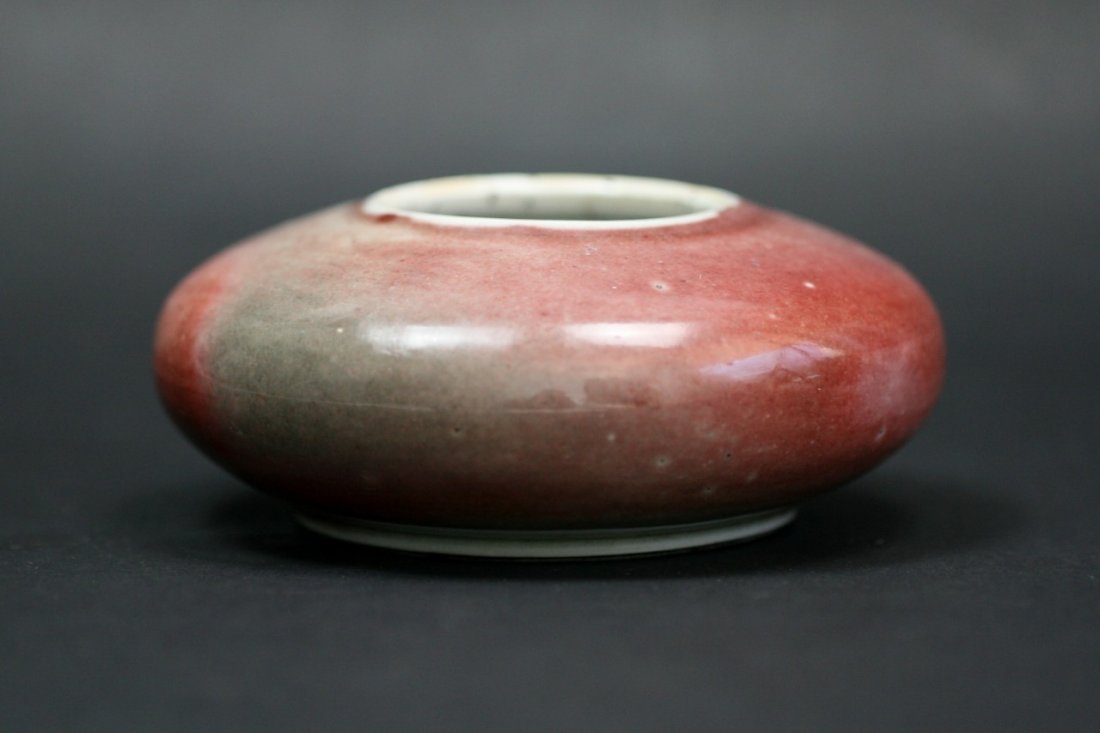 A Chinese Qing Peach Bloom Glazed Brush Washer: A Chinese Qing Peach Bloom Glazed Brush Washer: of shallow rounded form with small mouth, applied overall with peach bloom glaze while falling white on the rim, of late Qing Dynasty; Size: D: 4"