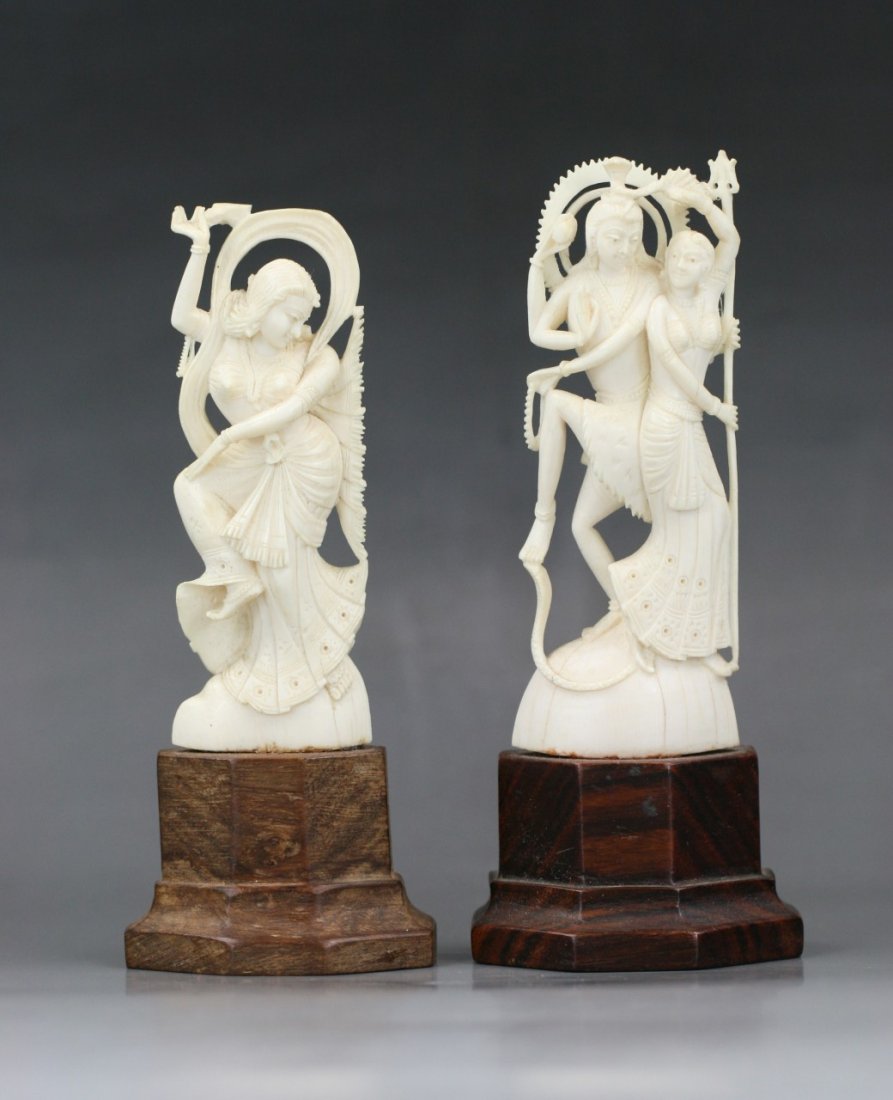 Two Indian Antique Ivory Goddesses: Two Indian Antique Ivory Goddesses: fully reticulated carved throughout as two goddesses, both mounted on matching wood stands, of 19th/20th Century; Size: H: 4" (ivory)