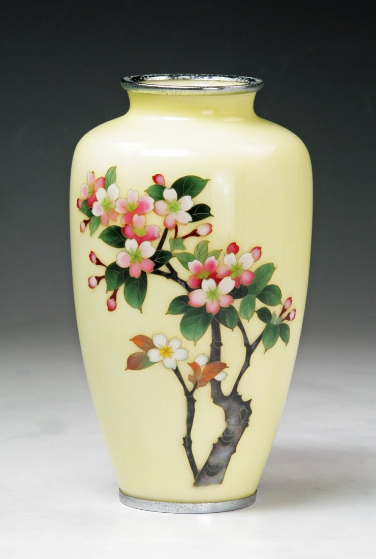 A Japanese Silver Ando Cloisonne Vase: A Japanese Silver Ando Cloisonne Vase; of tapered baluster from with short neck rising to flaring rim, finely enamelled around the body with blooming peony blossoms with leafy stems, all reserved on c