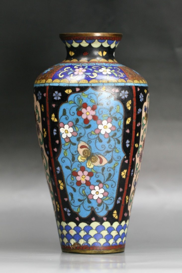A Japanese Antique Silver Ando Cloisonne Vase: A Japanese Antique Silver Ando Cloisonne Vase: reserved on a royal blue ground, of 19th Century; Size: H: 7-1/2"