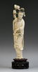 A Chinese Carved Qing Ivory Beauty With Flowers
