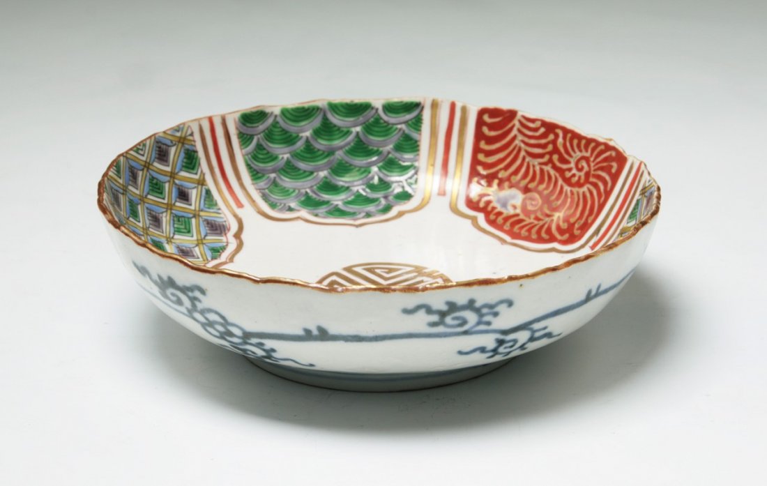 A Japanese Antique Gilt Arita Porcelain Bowl: A Japanese Antique Gilt Arita Porcelain Bowl: signed on the base, of late 19th Century; Size: D: 6"