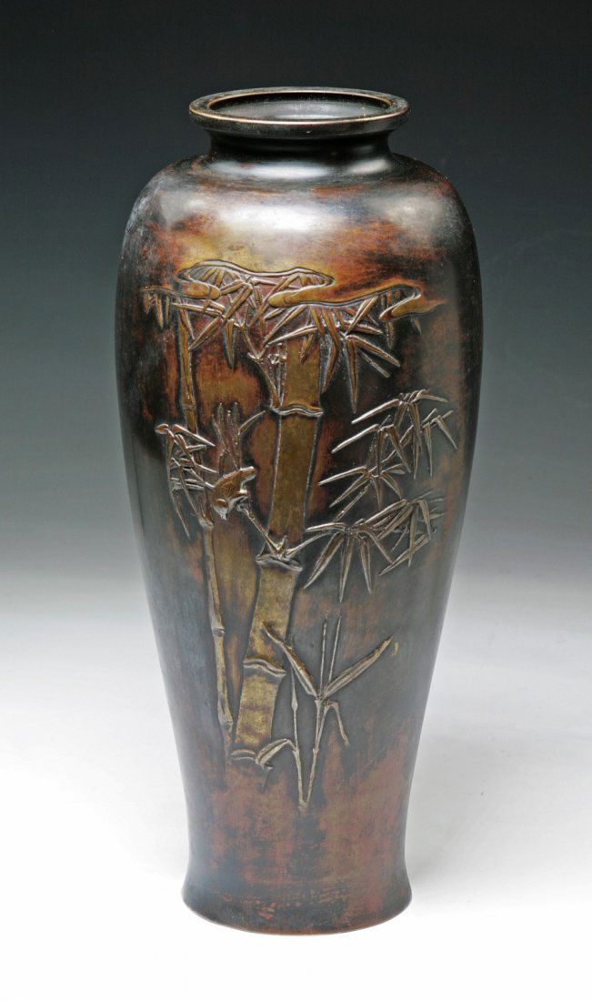 A Japanese Antique Bronze Vase: A Japanese Antique Bronze Vase: of shouldered body with short and wide neck, with the design of bamboo tree in relief on one side, circa 1900; Size: H: 13"