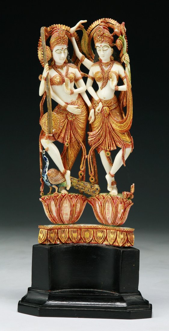 An Indian Antique Carved Gilt Ivory Goddesses: 象牙雕印度女神擺件 An Indian Antique Carved Gilt Ivory Goddesses: polychrome and gilt, very finely carved as two Indian Goddesses standing on two