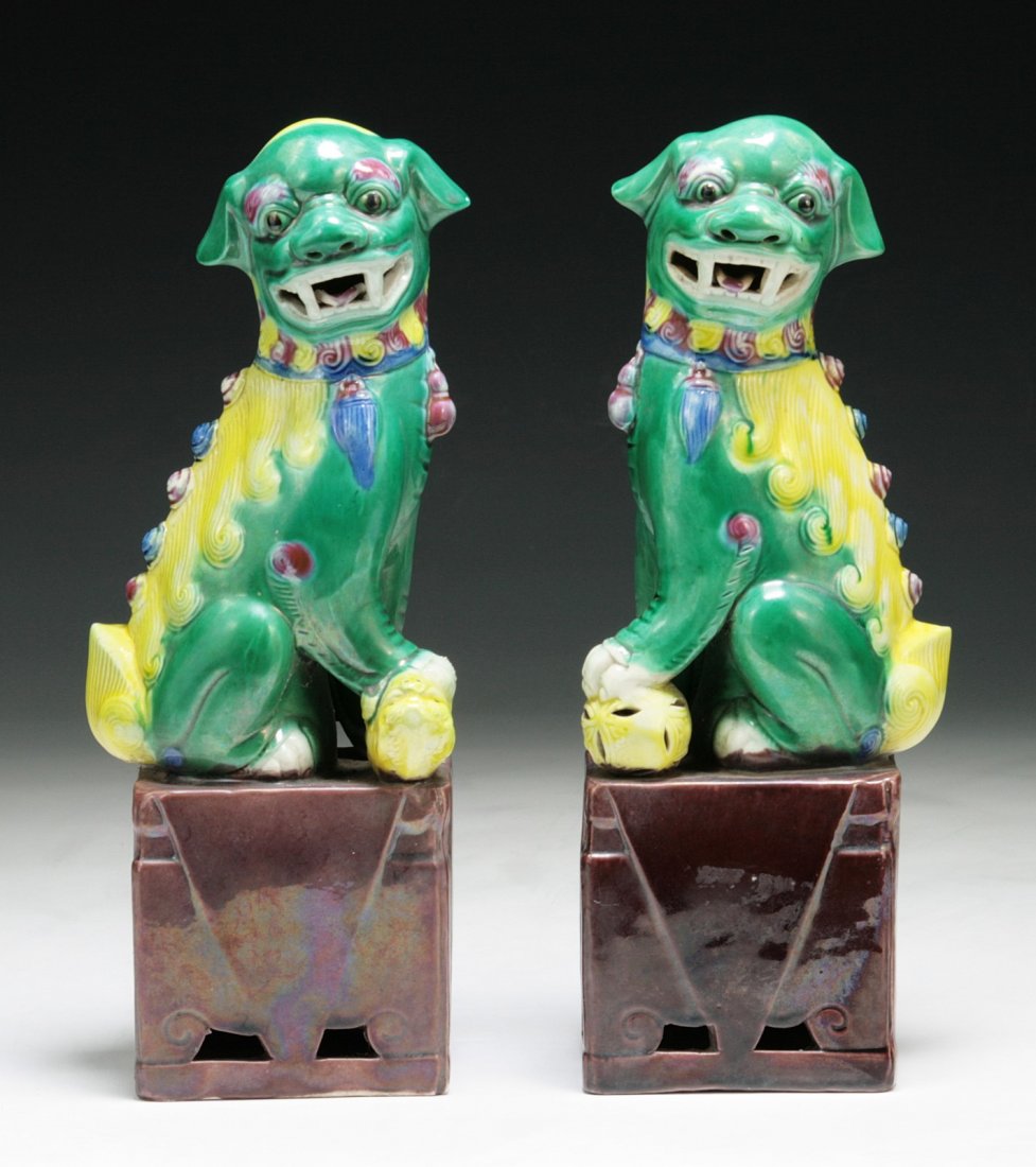 Pair of Chinese Antique Famille Rose Lions: Pair of Chinese Antique Famille Rose Lions: molded as lions in a seated position with heads turns left and right, on rectangular plinths, of Minguo Period; Size: H: 10-1/4"