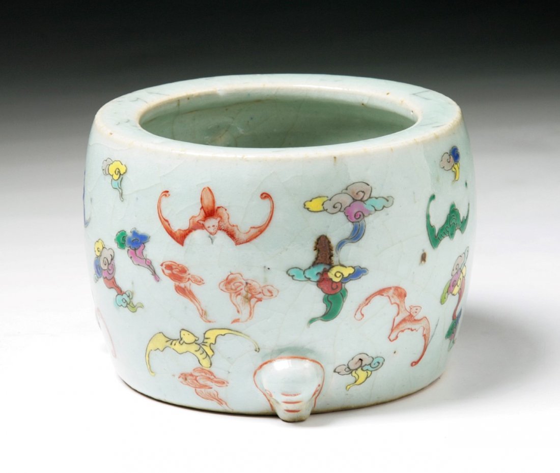 A Chinese Antique Famille Verte Tripod Censer: A Chinese Antique Famille Verte Tripod Censer: rested on tri pods, painted around the body with bats in flight amid cloud scrolls, signed on the base in cobalt blue within a double circle, of Qing Dyn