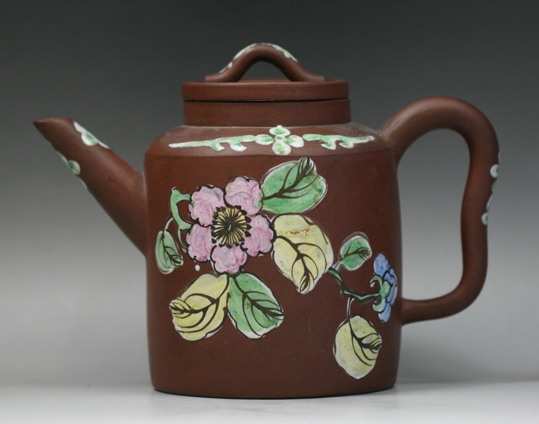 A Chinese Yixing Zisha Teapot: A Chinese Yixing Zisha Teapot: signed on the base; Size: H: 5-3/4"; L: 8-1/4"