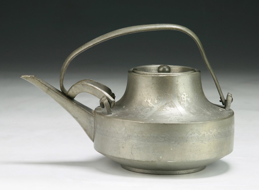 A Chinese Antique Tin Teapot: A Chinese Antique Tin Teapot: signed on the base; Size: L: 7-1/4"; H: 5"