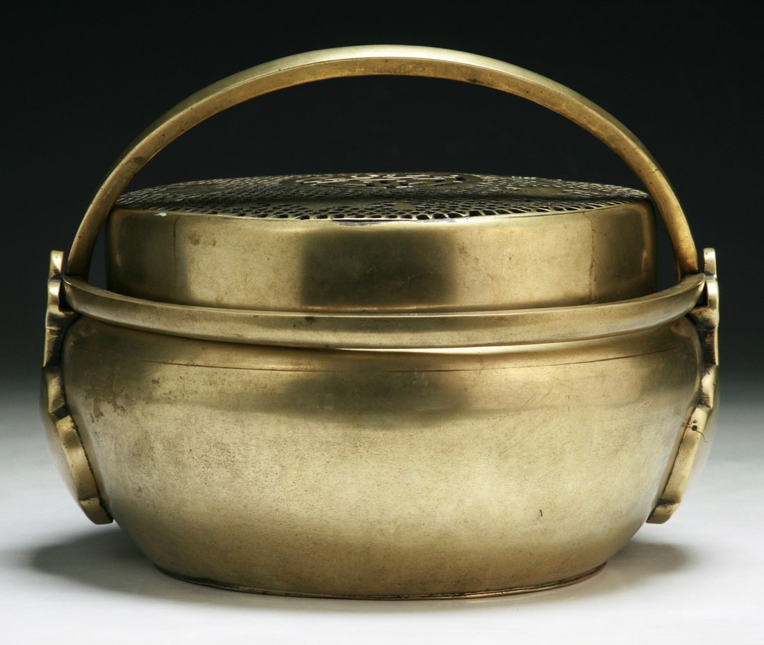 A Chinese Antique Bronze Hand Warmer: A Chinese Antique Bronze Hand Warmer: of rounded form, of Minguo Period; Size: D: 8"; H: 7"
