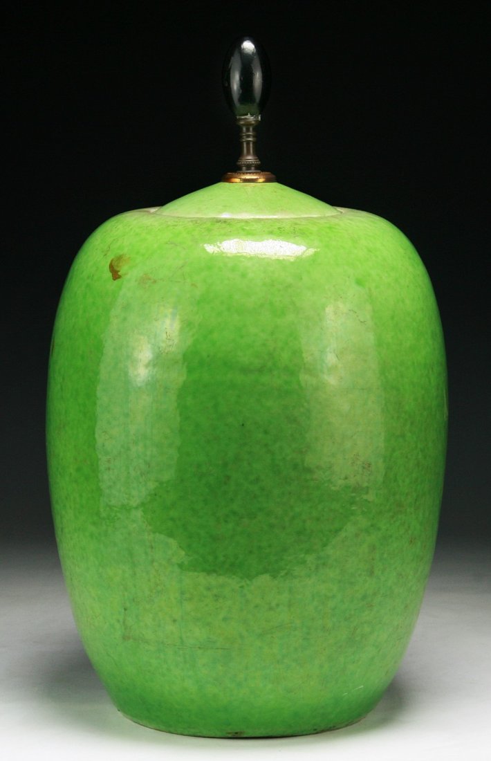 A Chinese Antique Green Lidded Porcelain Jar: A Chinese Antique Green Lidded Porcelain Jar: applied overall on the body and cover with apple green glaze, of Minguo Period; Size: H: 14-3/4"