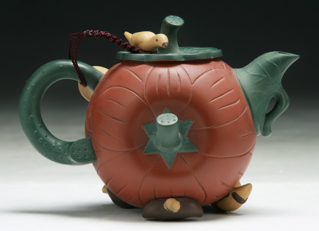 A Chinese Yixing Purple Clay Zisha Teapot: A Chinese Yixing Purple Clay Zisha Teapot; Size: L: 5-1/2"