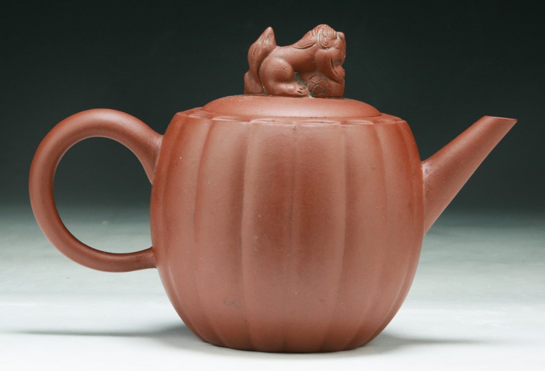 A Chinese Yixing Zisha Teapot: A Chinese Yixing Zisha Teapot; Size: L: 8-1/2"