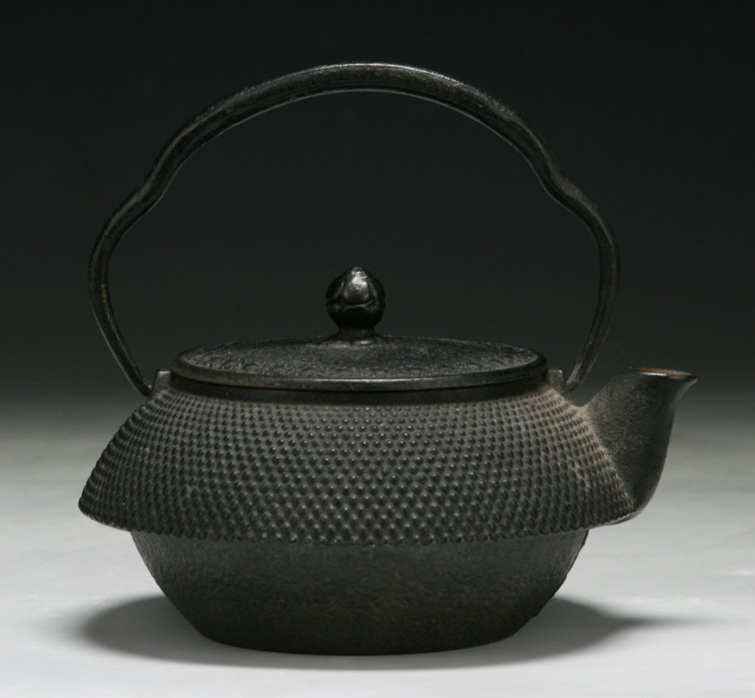 An Antique Japanese Iron Teapot: An Antique Japanese Iron Teapot; Size: H: 5-1/2"; L: 6-1/4"