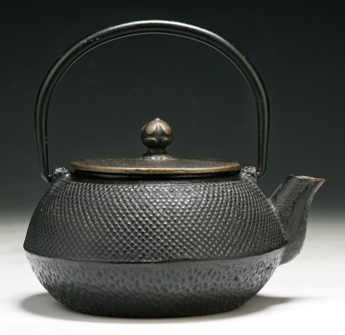 An Antique Japanese Iron Teapot: An Antique Japanese Iron Teapot; Size: H: 6-3/4"; L: 6-1/2"