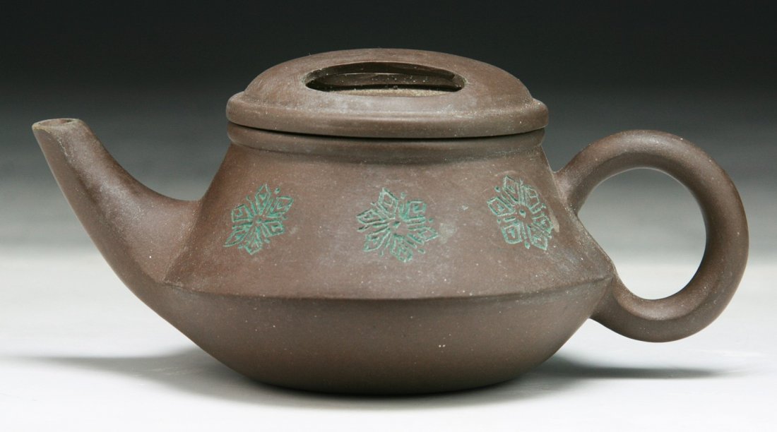 A Chinese Yixing Zisha Teapot: A Chinese Yixing Zisha Teapot; Size: L: 5-1/2"; H: 2-1/4"