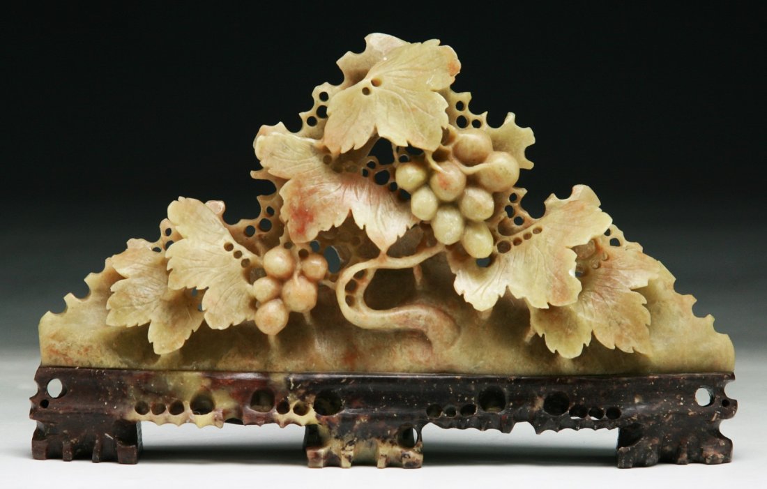 A Chinese Soapstone Carving With Stand: A Chinese Soapstone Carving With Stand: carved as grapes amid leafy branches; Size: L: 6-1/2"; H: 3-3/4"