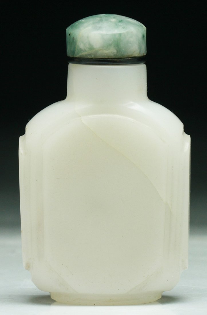 A Chinese Antique White Peking Glass Snuff Bottle: A Chinese Antique White Peking Glass Snuff Bottle: of rectangular section, with soapstone stopper, of Mid-Qing Dynasty; Size: H: 3"