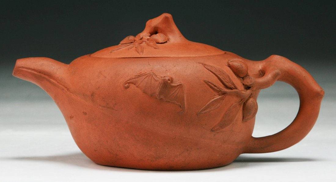 A Chinese Yixing Zisha Teapot: A Chinese Antique Yixing Zisha Pot; Size: L: 7-1/4"