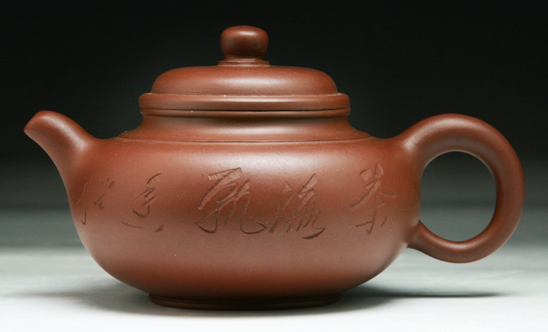 A Chinese Yixing Zisha Teapot: A Chinese Yixing Zisha Teapot; Size: L: 6-1/4"