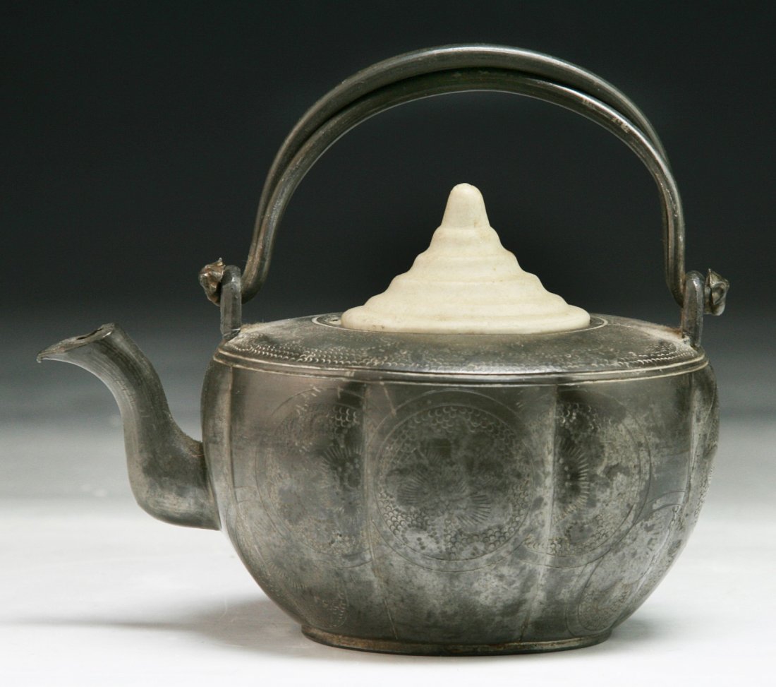A Chinese Antique Tin Teapot With Cover: A Chinese Antique Tin Teapot With Cover: signed and of Late Qing Dynasty; Size: L: 5"