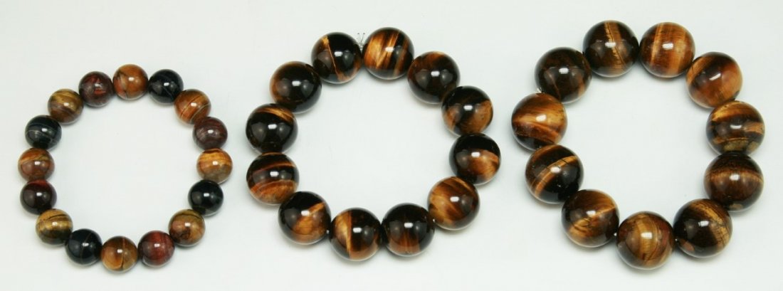 Three (3) Big Tiger Eye Beaded Bracelets: Three (3) Big Tiger Eye Beaded Bracelets: each comprised of beads of even size measuring 20mm each; Size: D: 3-1/2"; (bead) D: 20mm