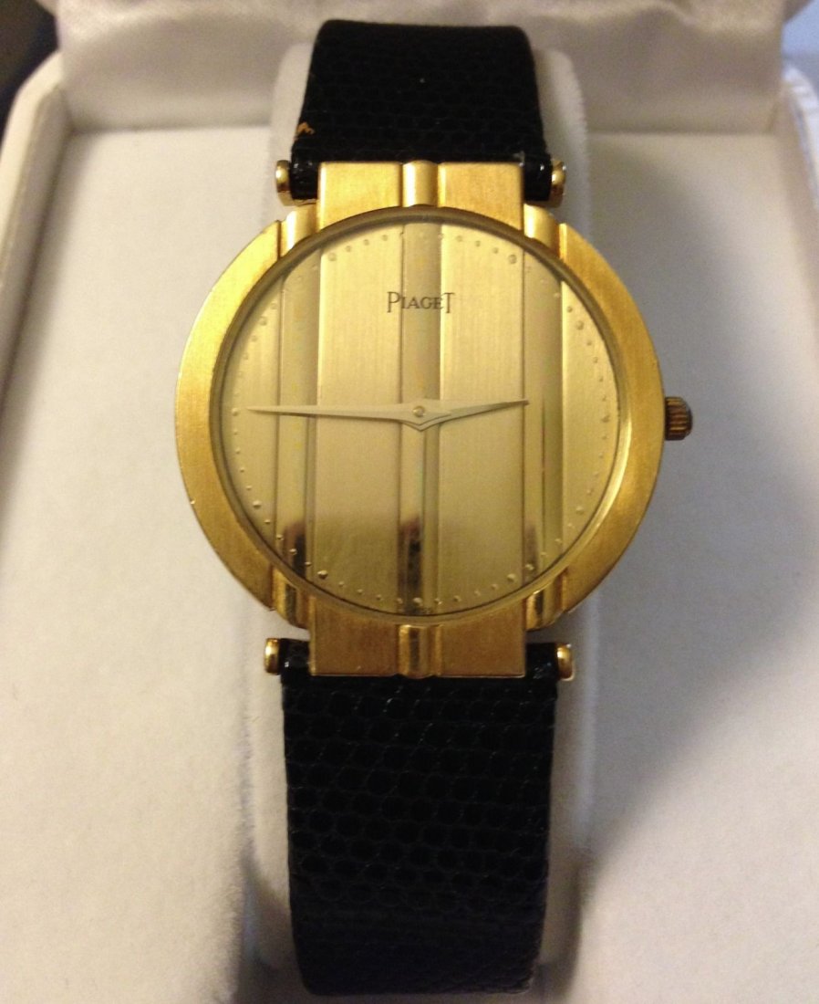 A PIAGET Polo 18K Solid GOLD Gents Watch: A PIAGET Polo 18K Solid GOLD Men's Watch: genuine Tiffany and Co. Lizard Watch band in 17L. Movement: High quality Quartz.; Size: Case: 31.5mm, Crown: 33.5mm Lug to Lug