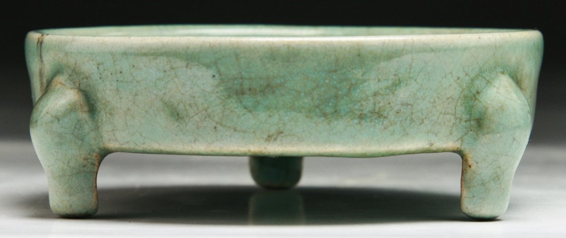 A Chinese Antique Celadon Glazed Porcelain Xi: A Chinese Antique Celadon Glazed Porcelain Xi: with attractive crackle network to the interior and exterior, three spurs on the base and probably of Song Dynasty; Size: D: 3-1/4"