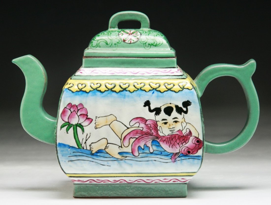 A Chinese Antique Polychrome Yixing Zisha Teapot: 民國加彩釉紫砂壺 A Chinese Antique Polychrome Yixing Zisha Teapot: of Minguo period; Size: L: 7"