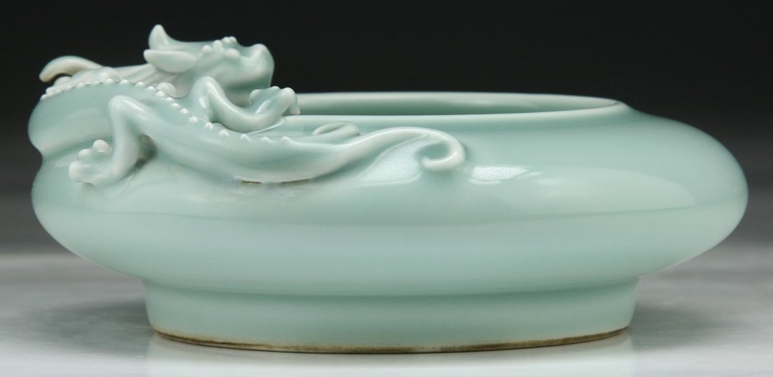 A Chinese Antique Clair-De-Lune Glazed Brush Washer: A Chinese Antique Clair-De-Lune Glazed Porcelain Brush Washer: well potted as a brush washer with a Chilong encircling around the mouth, applied overall with a Clair-de-lune glaze, with 'YONGZHENG' se