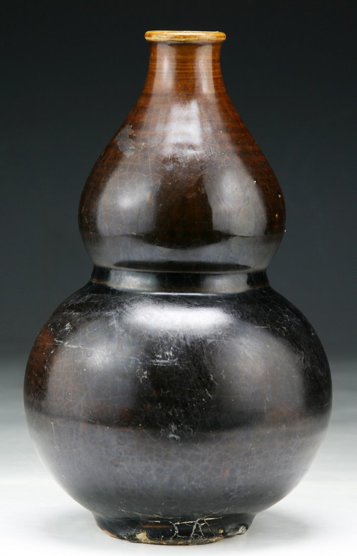 A Korean Antique Persimmon Glazed Gourd Vase: A Korean Antique Persimmon Glazed Gourd Vase; Size: H: 8"