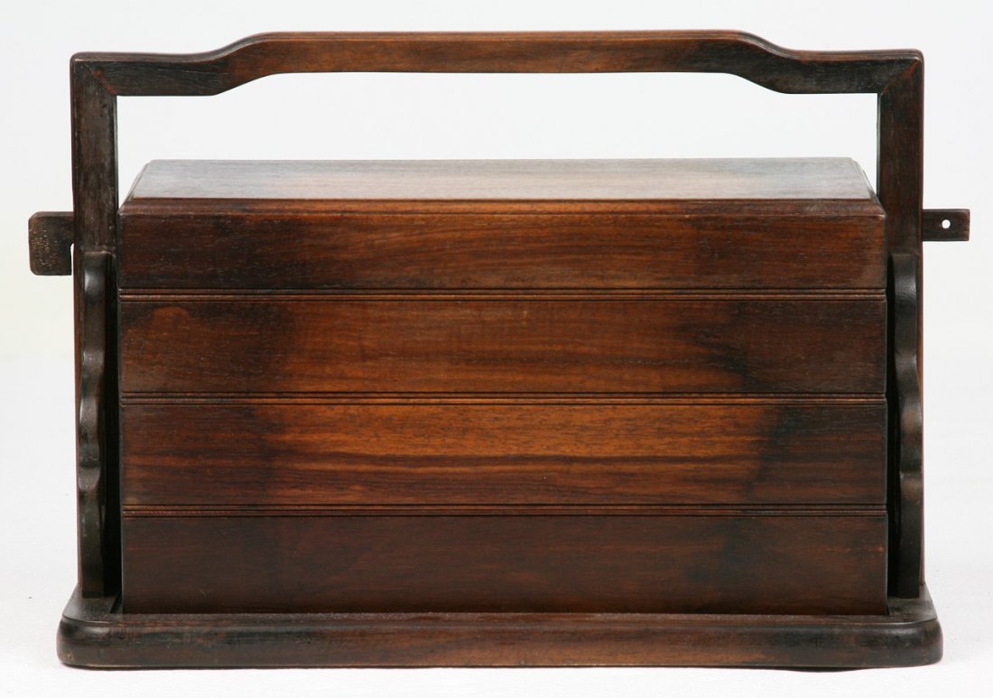 A Chinese Carved Wood Tiered Food Box: A Chinese Carved Wood Tiered Food Box; Size: L: 16-1/2"