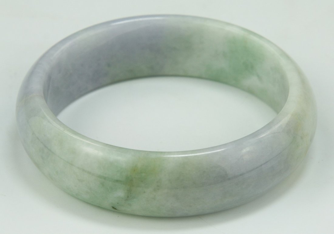 A Lavender Jadeite Bangle: A Lavender Jadeite Bangle; Size: D: 75mm; Thickness: 22mm