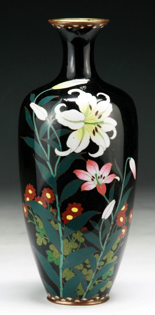 A Japanese Antique Silver Ando Cloisonne Vase: A Japanese Antique Silver Ando Cloisonne Vase: of shouldered body with waisted neck rising to a flared rim, enamelled with blooming lily blossoms, of 19th Century; Size: H: 9-1/2"