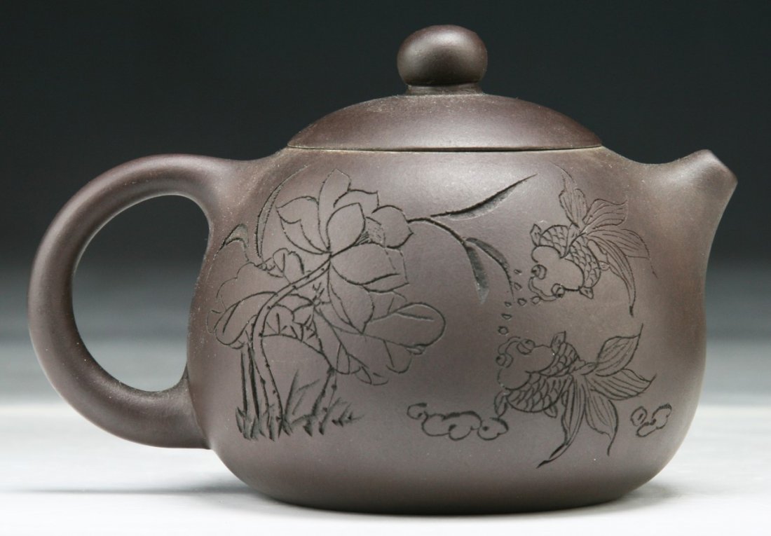 A Chinese Yixing Zisha Teapot With Cover: A Chinese Yixing Zisha Teapot With Cover; Size: L: 4-3/4"
